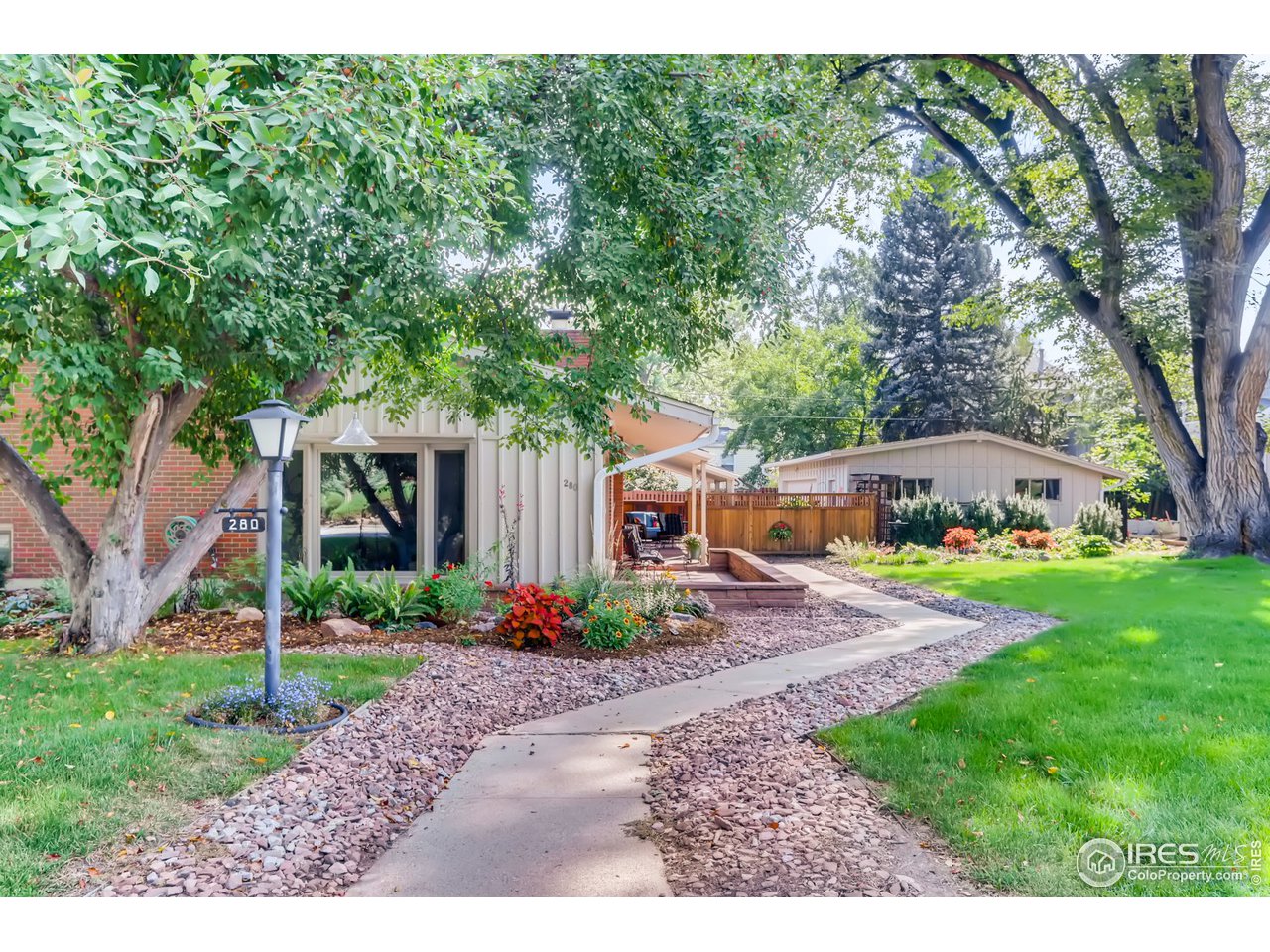 280 Echo Place Boulder, CO 80302 - Photo 2 of 40 a front view of a house with garden