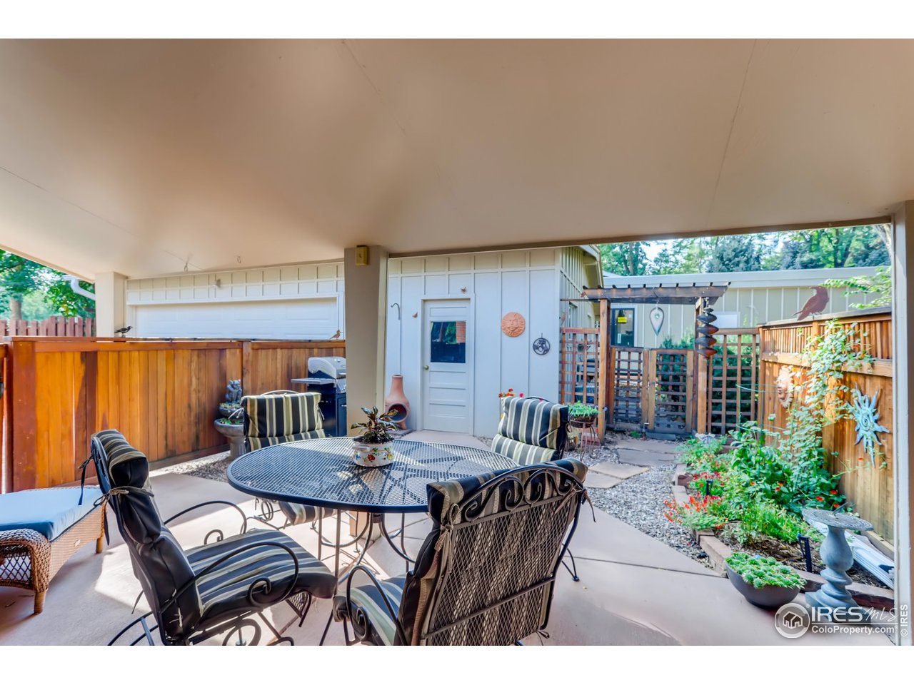 280 Echo Place Boulder, CO 80302 - Photo 32 of 40 a backyard of a house with a table and chairs