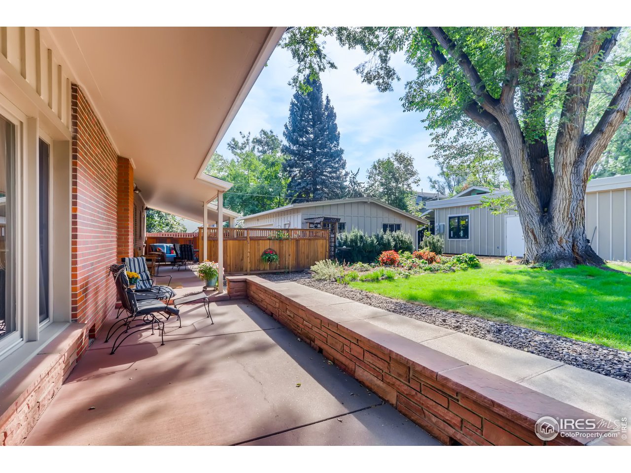 280 Echo Place Boulder, CO 80302 - Photo 6 of 40 a view of house with backyard outdoor seating and hardwood