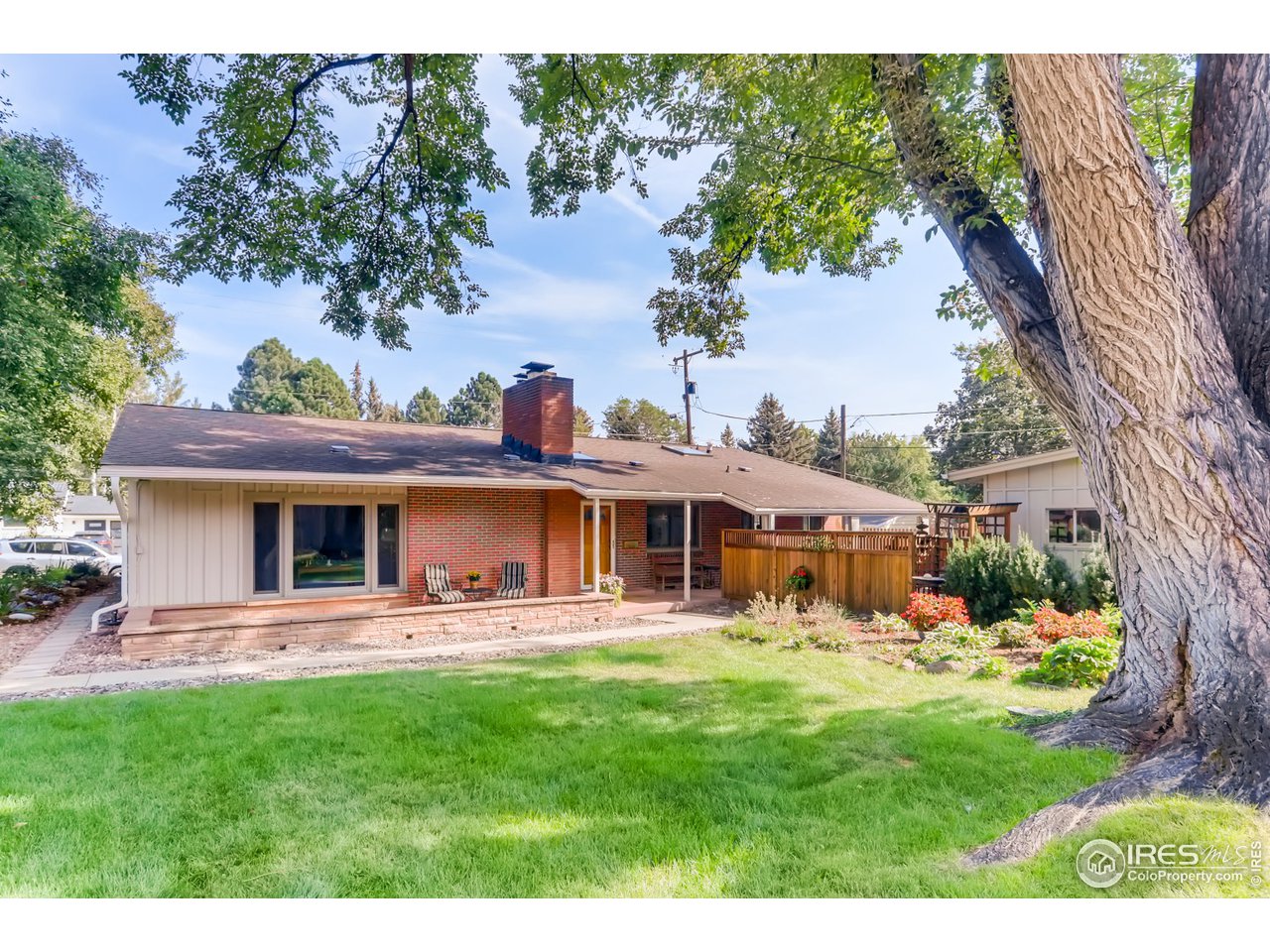 280 Echo Place Boulder, CO 80302 - Photo 7 of 40 a front view of a house with a yard table and chairs