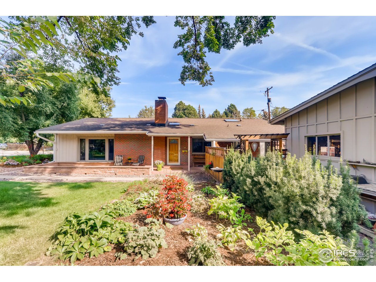 280 Echo Place Boulder, CO 80302 - Photo 8 of 40 a front view of a house with a garden and plants