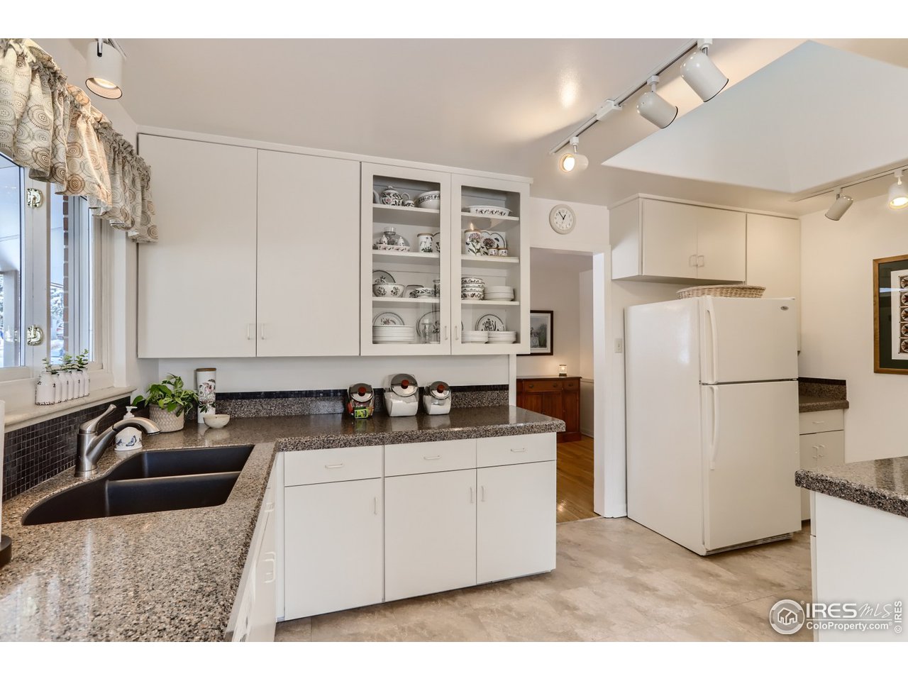 280 Echo Place Boulder, CO 80302 - Photo 10 of 40 a kitchen with a sink appliances and cabinets