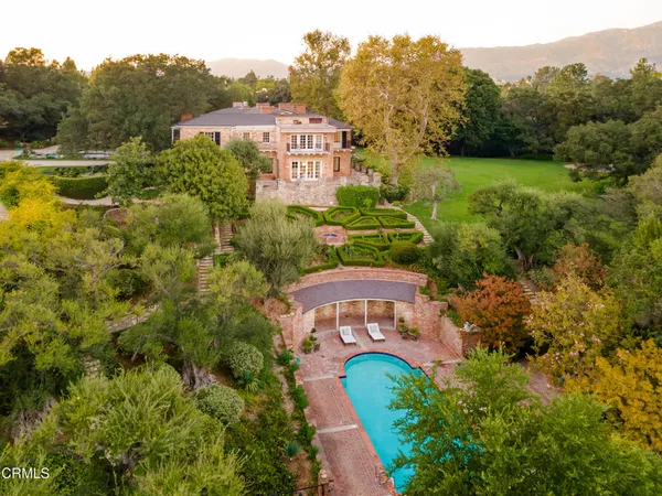 an aerial view of a house with a garden