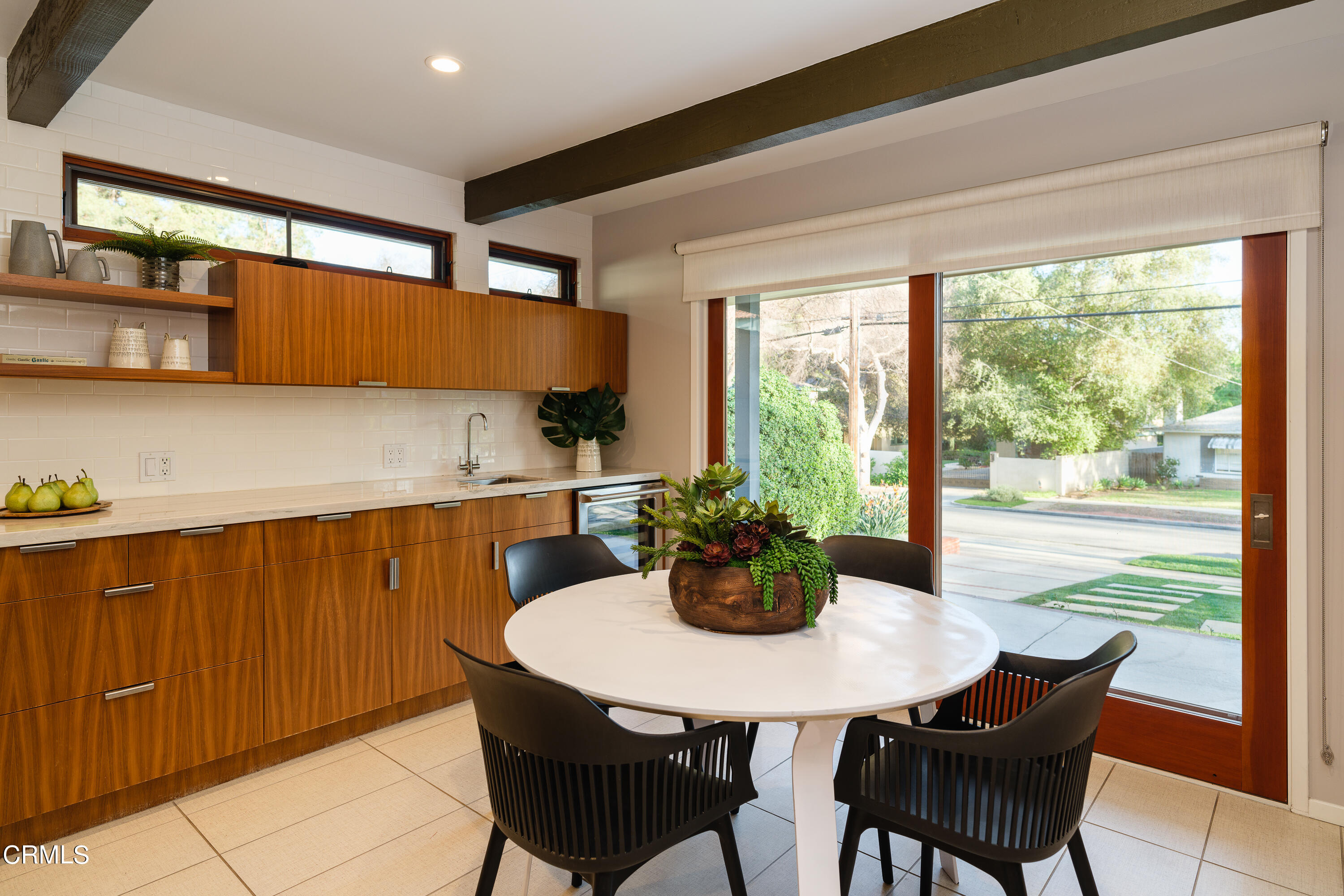 1025 Nithsdale Road Pasadena, CA 91105 - Photo 22 of 73 a dining room with furniture a window and a potted plant