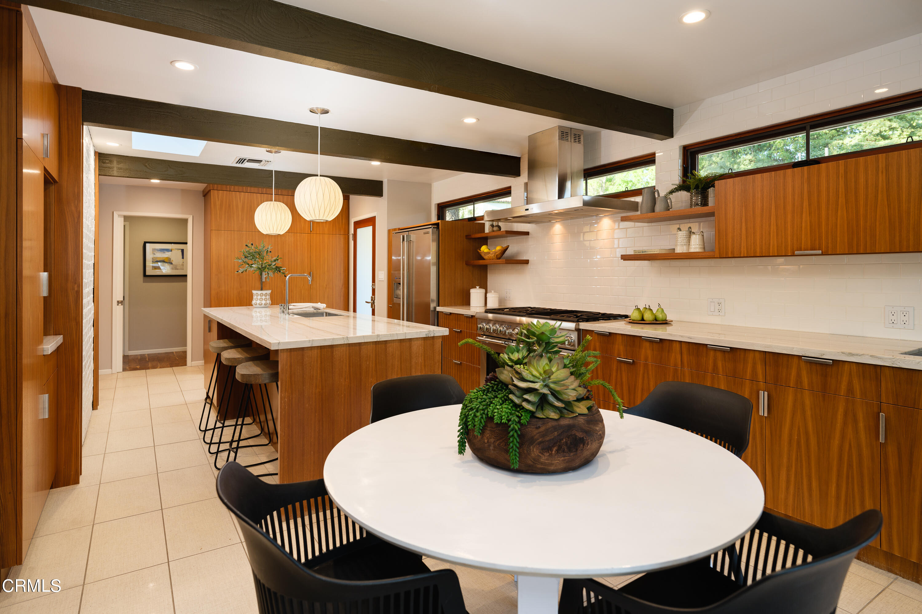 1025 Nithsdale Road Pasadena, CA 91105 - Photo 23 of 73 a view of a dining room with furniture and a chandelier