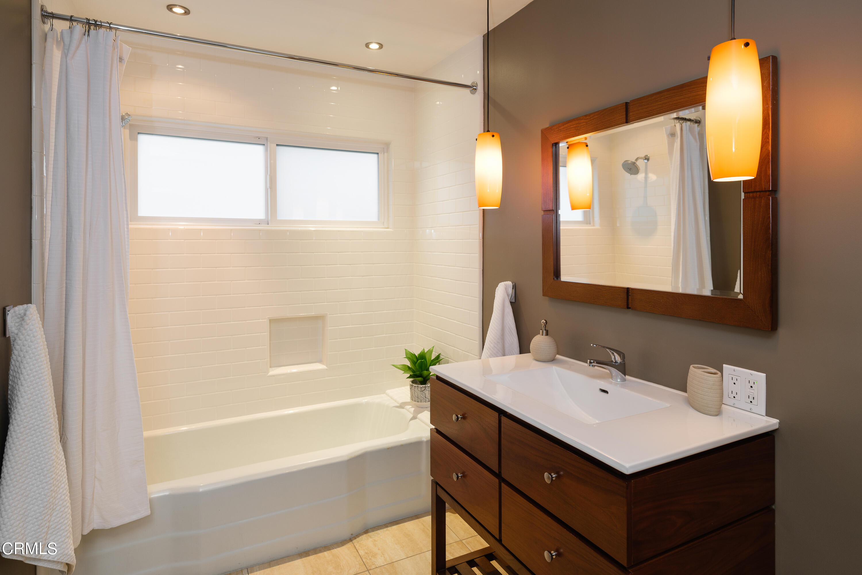 1025 Nithsdale Road Pasadena, CA 91105 - Photo 40 of 73 a bathroom with a sink and a mirror