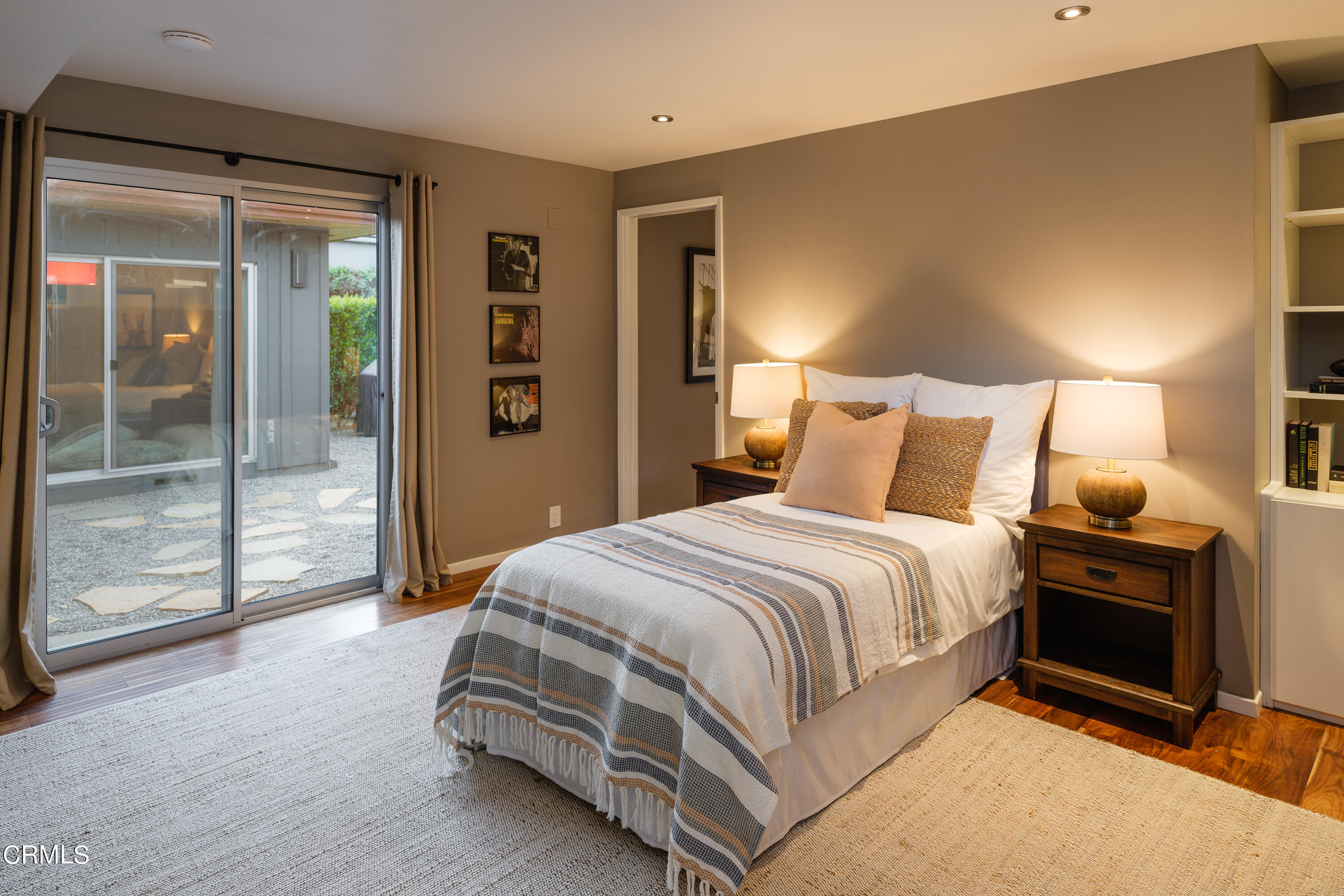 1025 Nithsdale Road Pasadena, CA 91105 - Photo 42 of 73 a bedroom with a bed and wooden floor