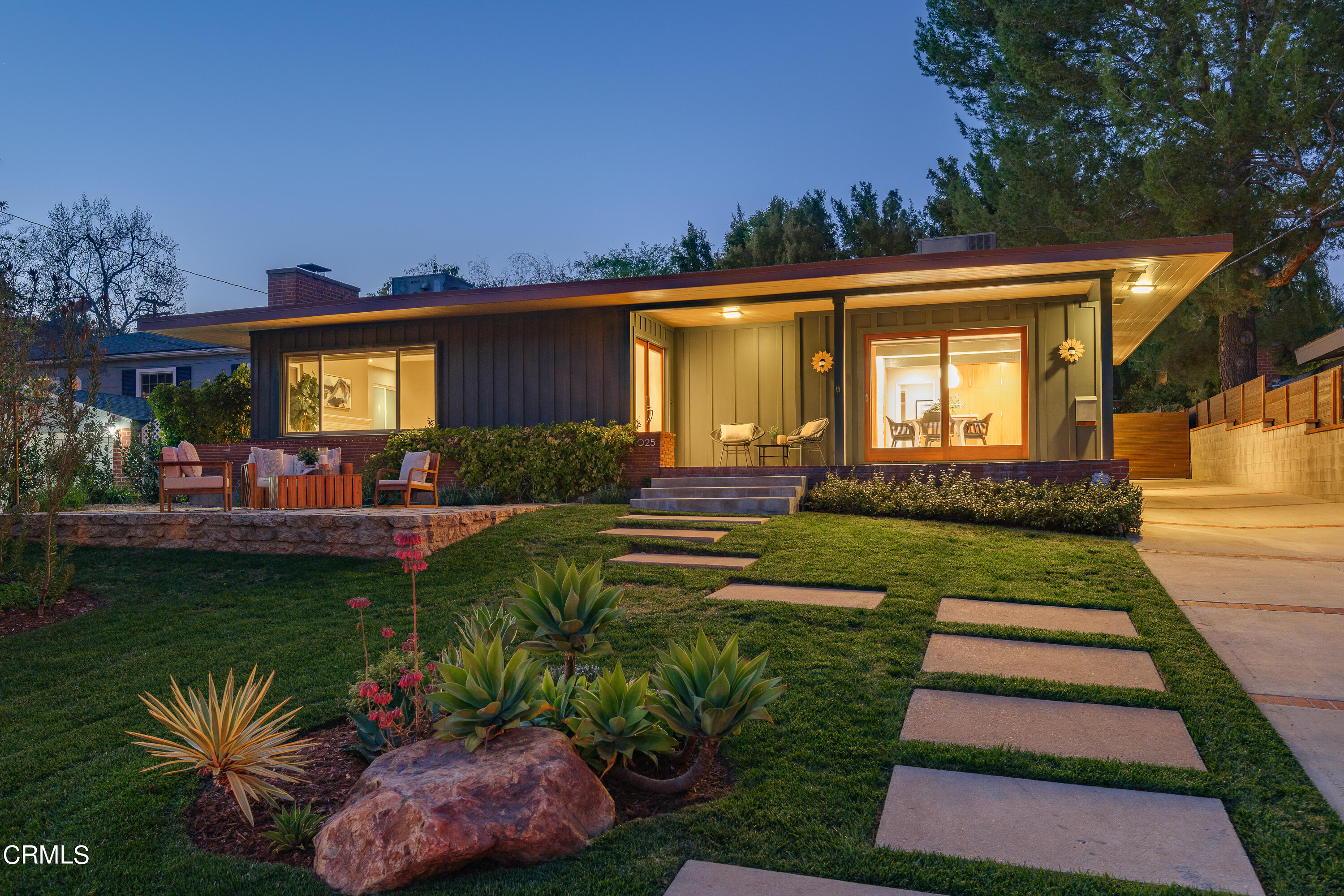 1025 Nithsdale Road Pasadena, CA 91105 - Photo 59 of 73 a front view of a house with a yard table and chairs