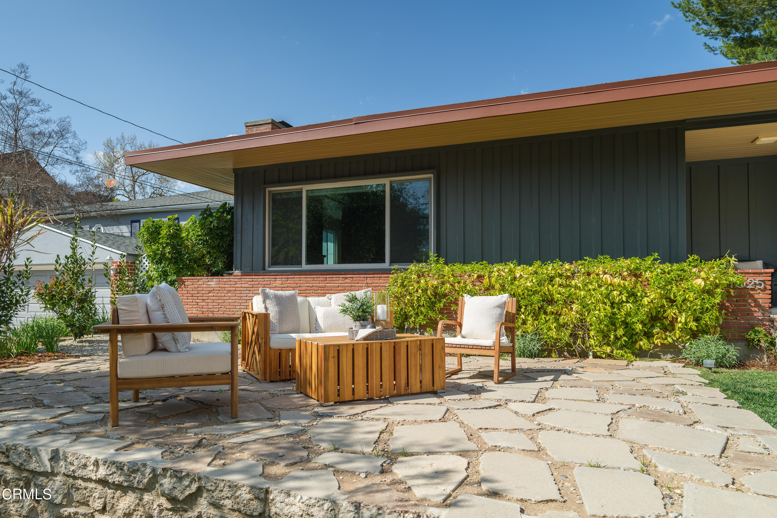 1025 Nithsdale Road Pasadena, CA 91105 - Photo 6 of 73 a view of a chair and table in the backyard