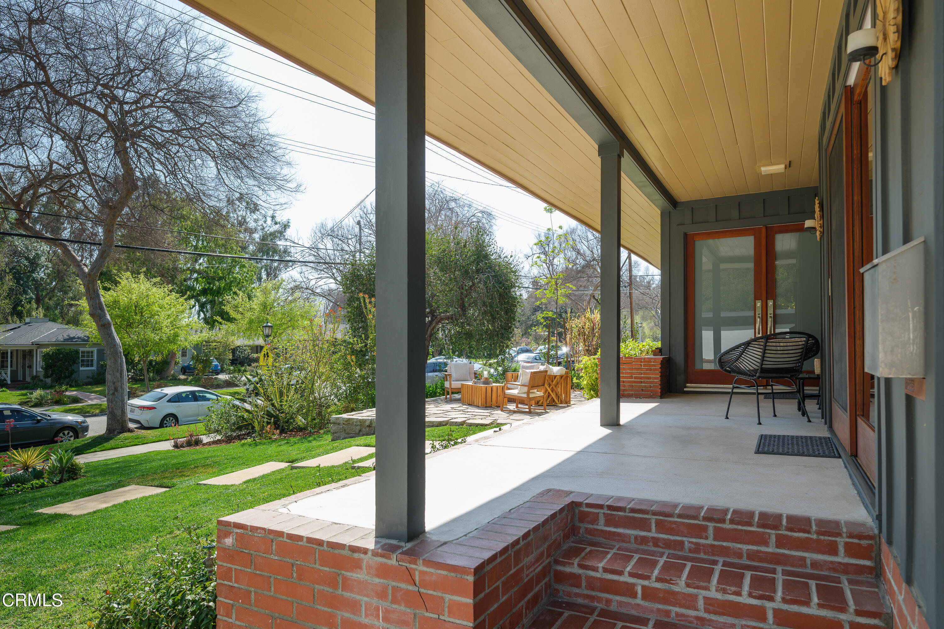 1025 Nithsdale Road Pasadena, CA 91105 - Photo 7 of 73 a view of a porch with chairs and backyard