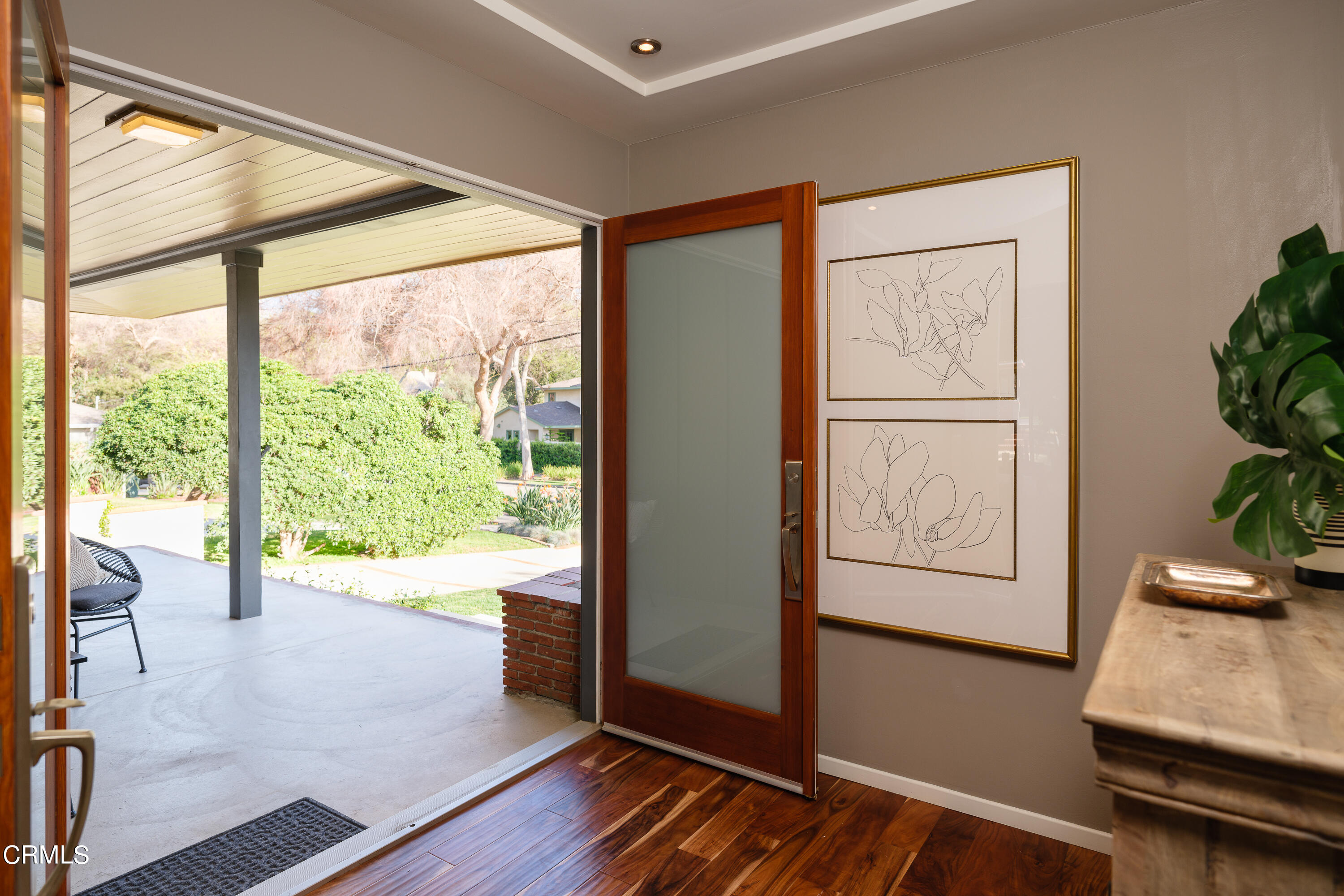 1025 Nithsdale Road Pasadena, CA 91105 - Photo 10 of 73 a view of an empty room with a window and wooden floor