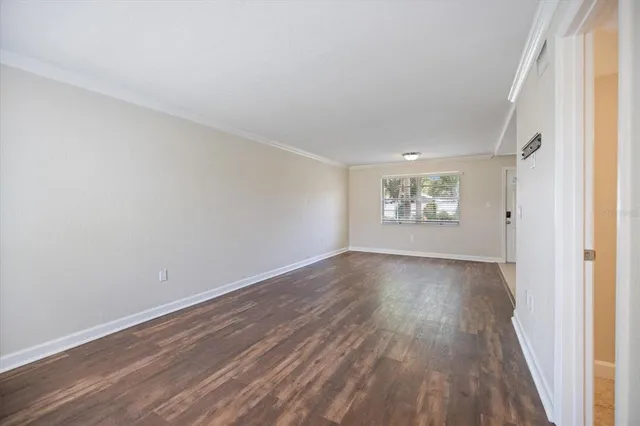 a view of an empty room and a window