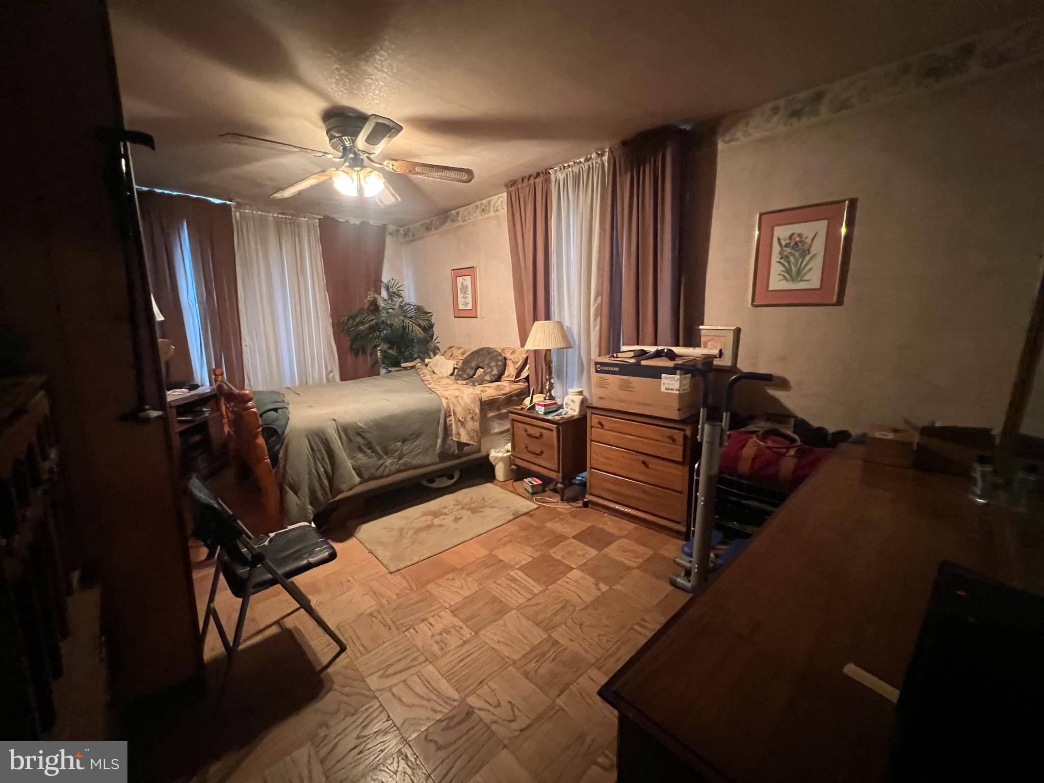 2441 Carpenter Street Philadelphia, PA 19146 - Photo 19 of 34 a bedroom with furniture and a chandelier