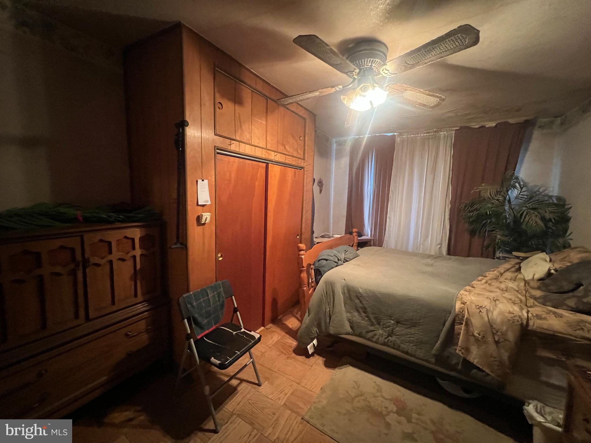 2441 Carpenter Street Philadelphia, PA 19146 - Photo 20 of 34 a bedroom with a bed and a chandelier