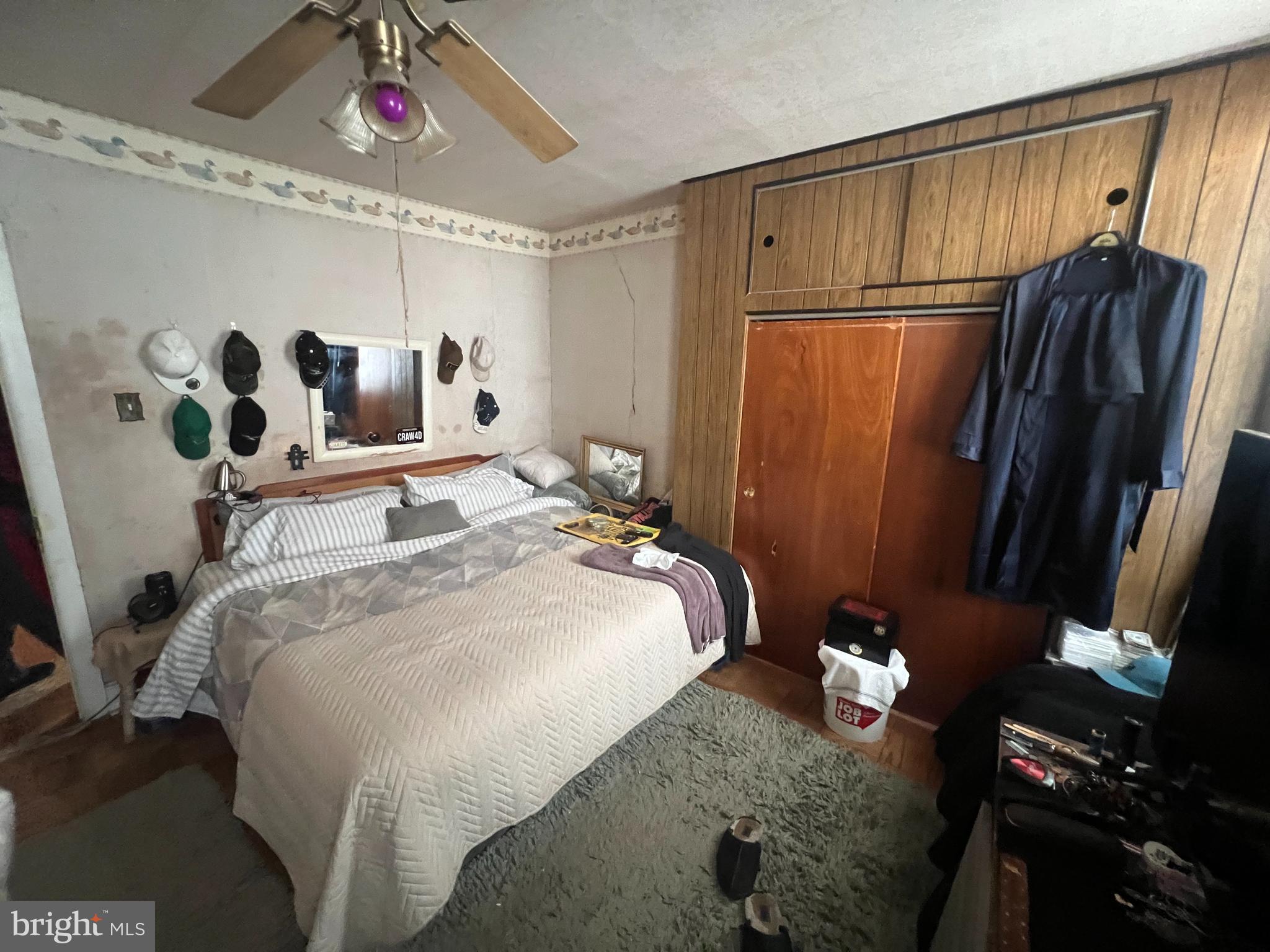 2441 Carpenter Street Philadelphia, PA 19146 - Photo 25 of 34 a bedroom with a bed and wooden floor