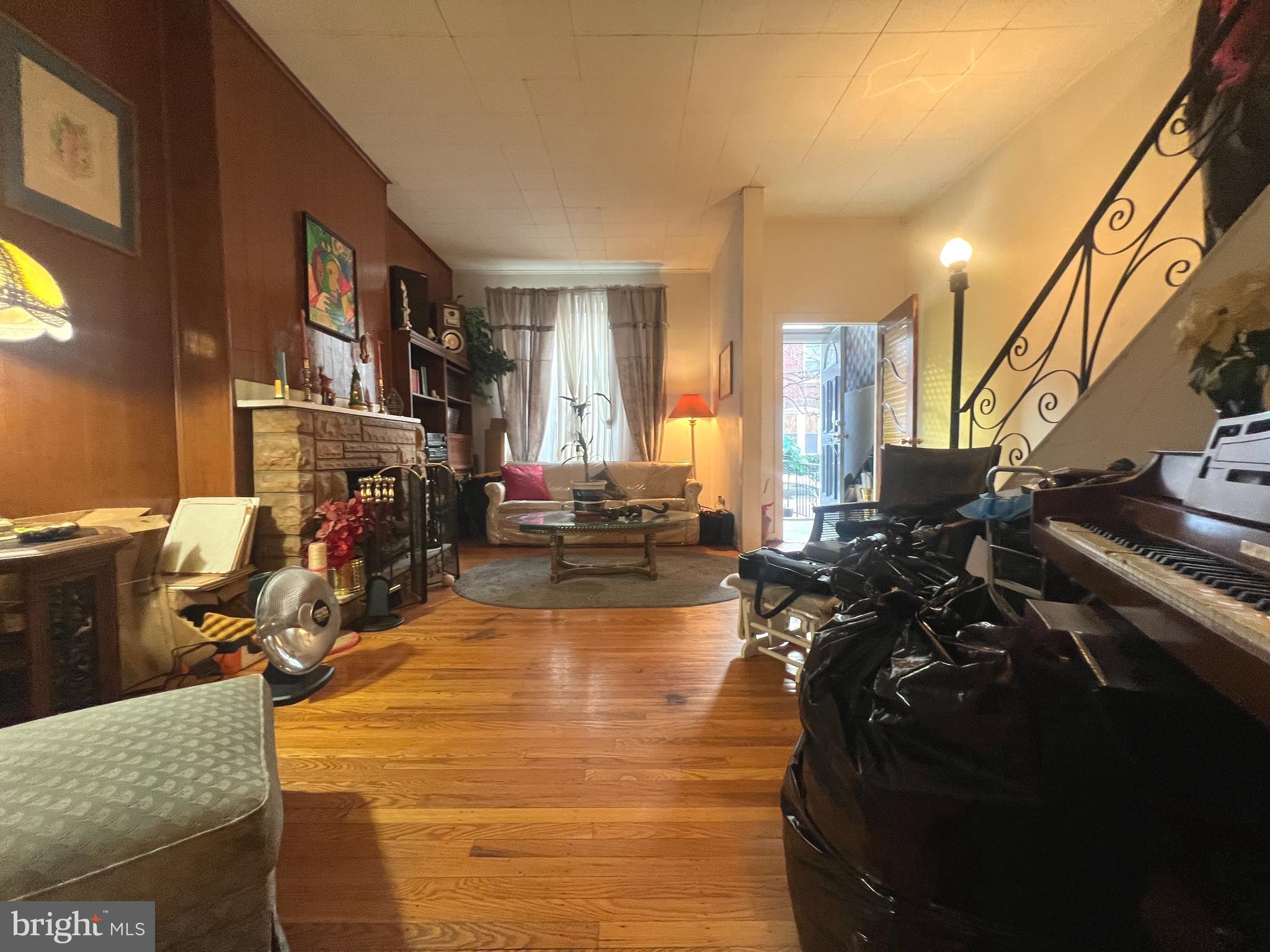 2441 Carpenter Street Philadelphia, PA 19146 - Photo 5 of 34 a living room with furniture a flat screen tv and a window