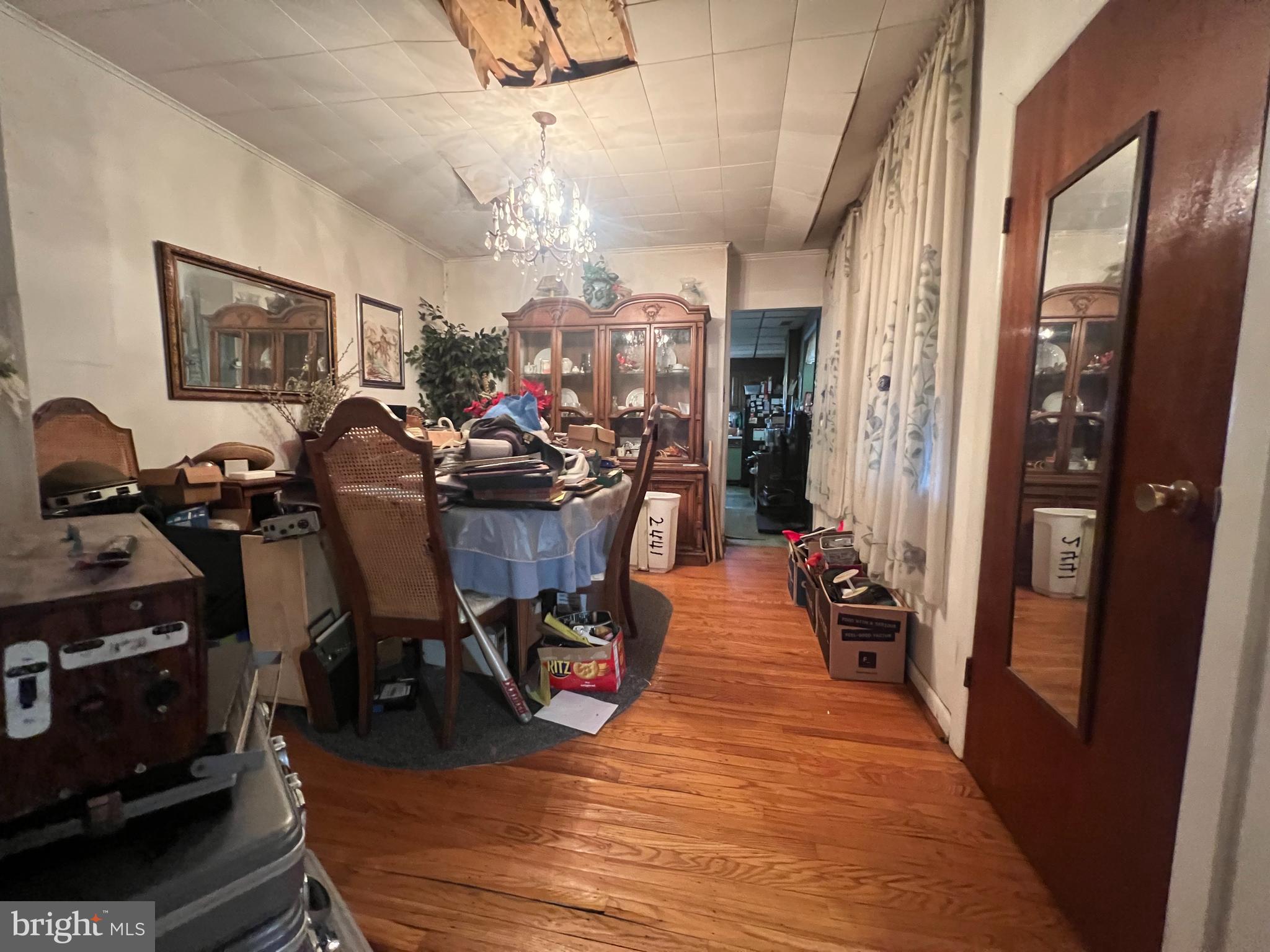 2441 Carpenter Street Philadelphia, PA 19146 - Photo 9 of 34 a view of a dining room with furniture a chandelier and wooden floor