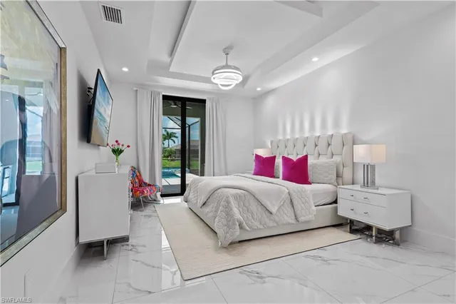 a bedroom with bed and a large mirror