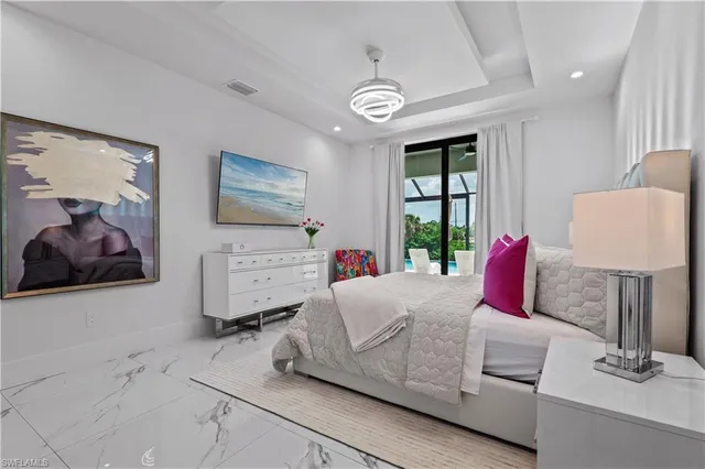a view of a bathroom with a tub shower and mirror