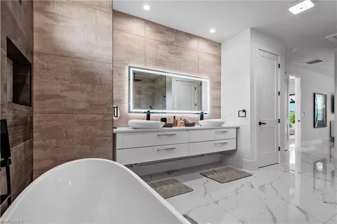 a white bath tub sitting in a bathroom