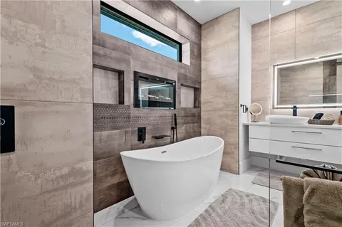 a white bath tub sitting in a bathroom