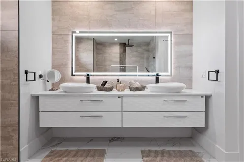 a living room with furniture bathtub and next to a window