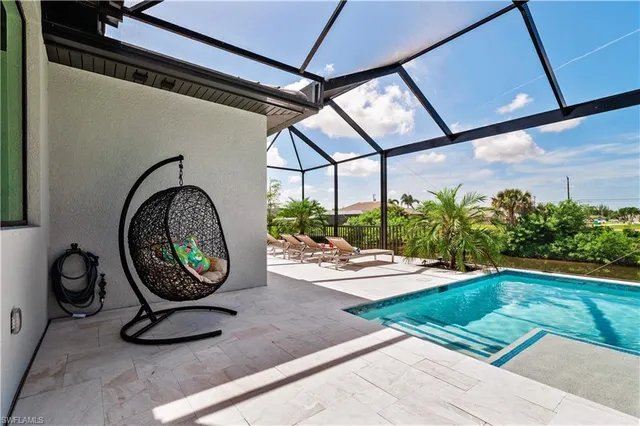 a view of a kitchen with table and chairs
