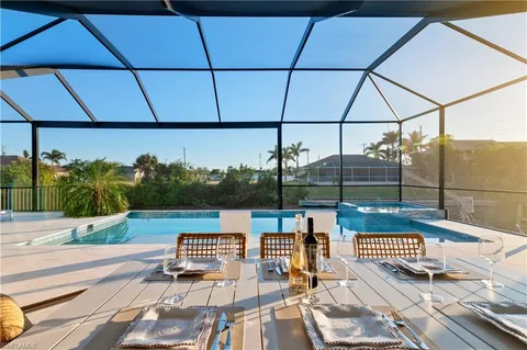 a view of a patio with a table and chairs
