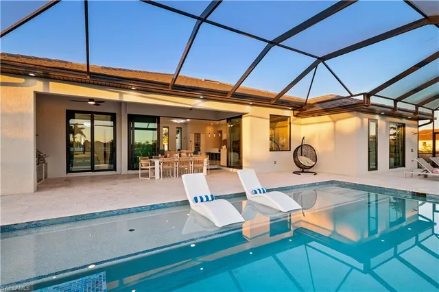 a view of a swimming pool with a patio