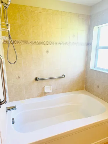 a bathroom with a bath tub