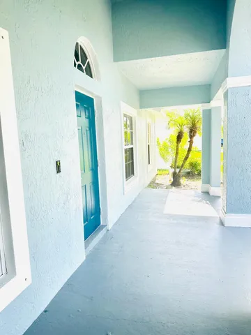 a view of an entryway with wooden floor