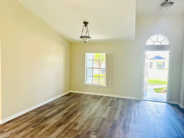 a view of an empty room with a window