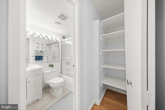 a bed room with a bed window and table