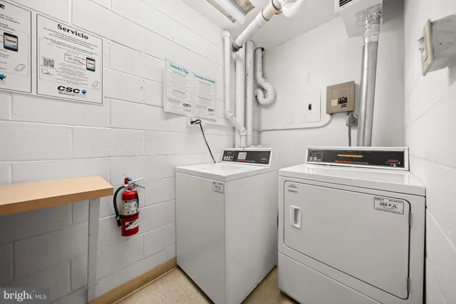 a view of patio with table and chairs and potted plants