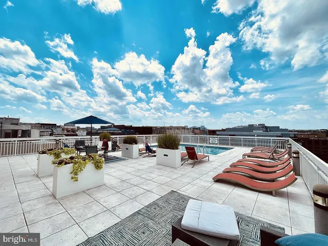 a view of swimming pool with lounge chair