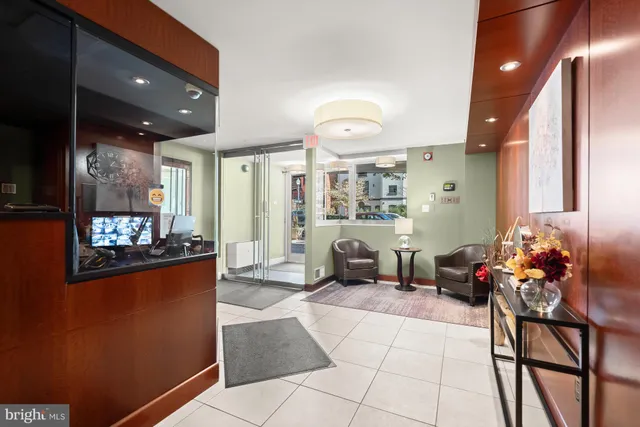 a lobby with furniture and rug