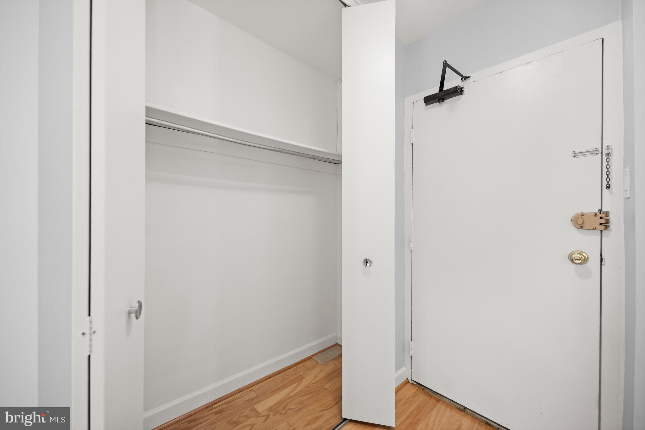 1260 21st Street Northwest, Unit 107 Washington, DC 20036 - Photo 6 of 21 a view of a room with rack on the wall