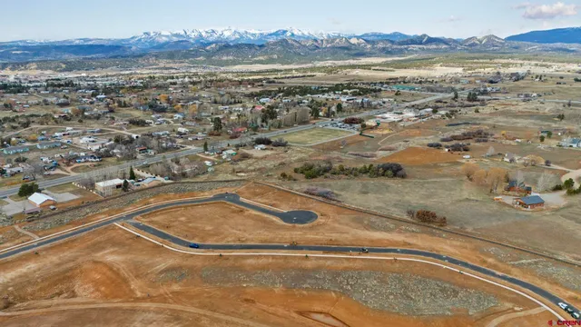 an aerial view of residential building and parking space