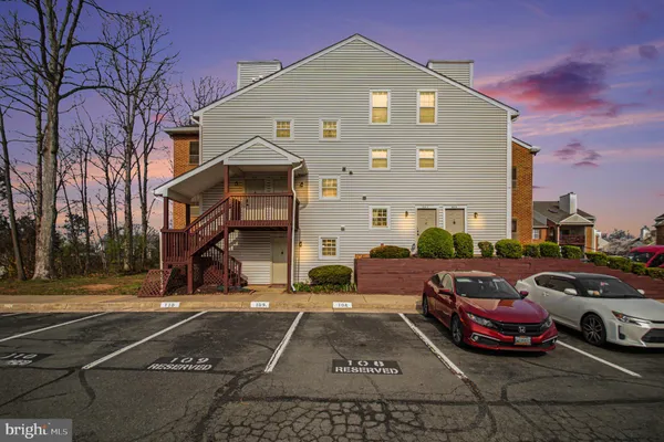 a front view of a house with parking space