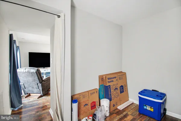 a bed room with a bed and a television