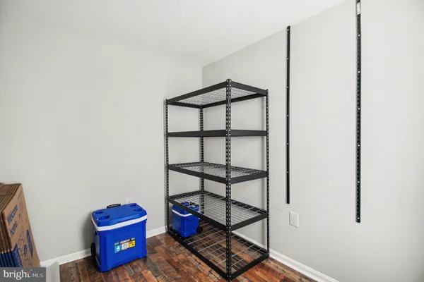 a front view of a room with racks on the wall
