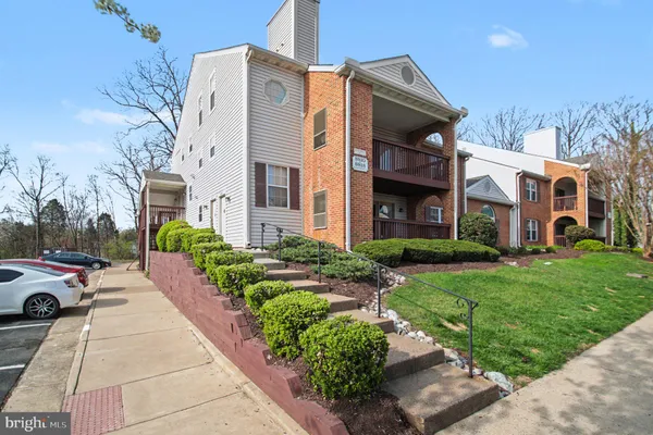 a view of a building with a yard