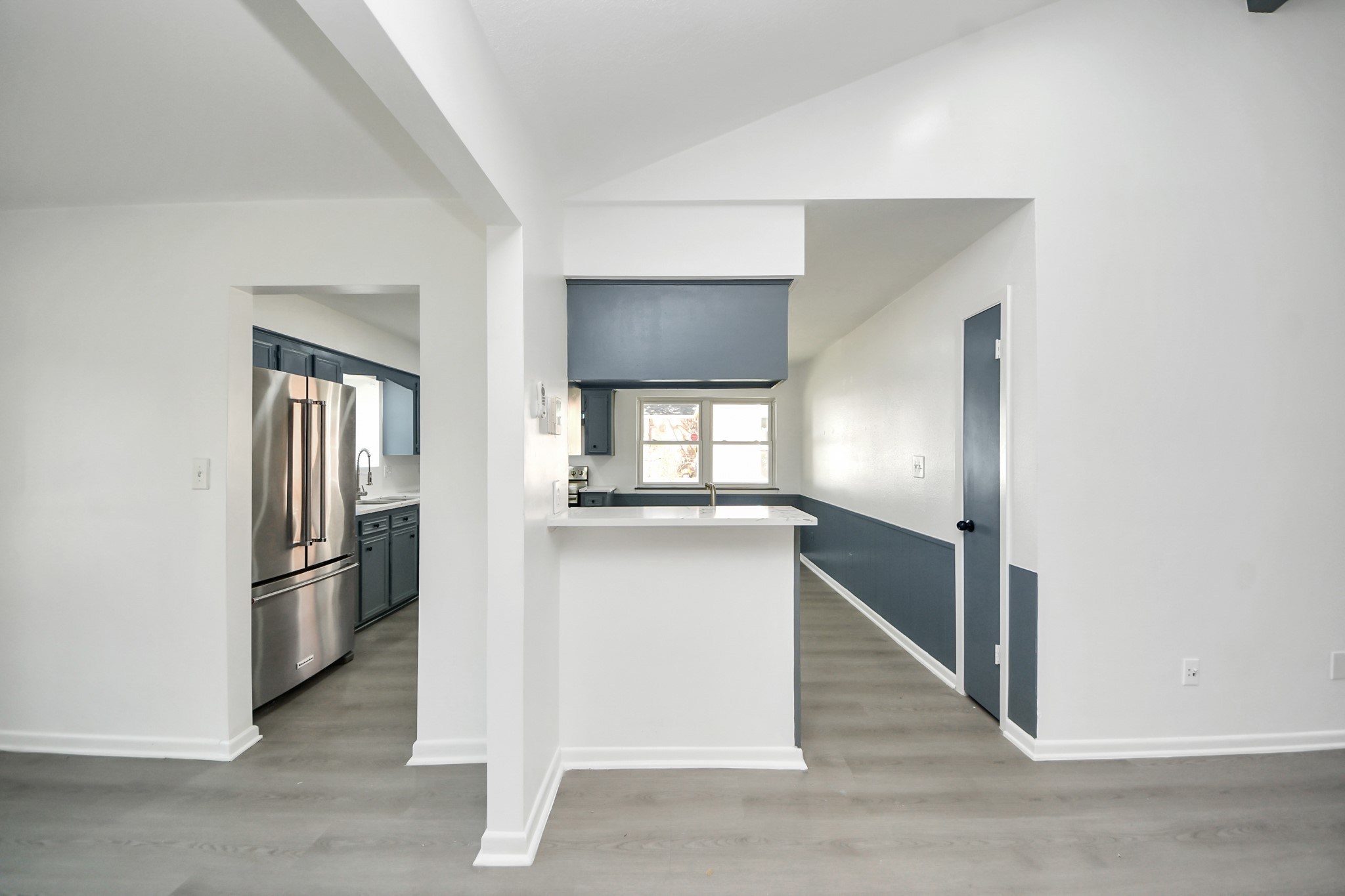 23002 Grand Rapids Lane Spring, TX 77373 - Photo 18 of 41 a kitchen with kitchen island a refrigerator and a stove