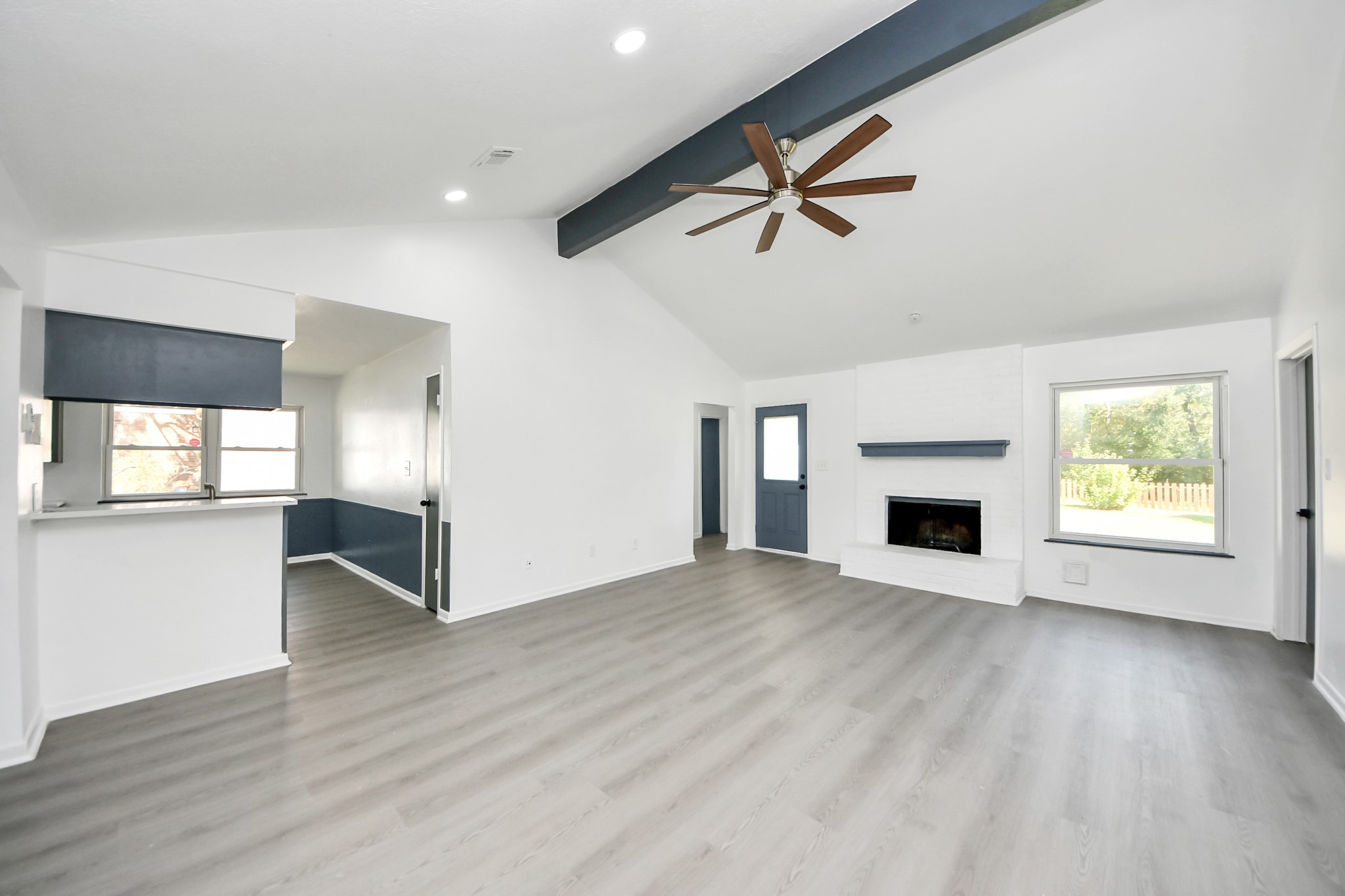 23002 Grand Rapids Lane Spring, TX 77373 - Photo 19 of 41 a view of empty room with wooden floor and fireplace