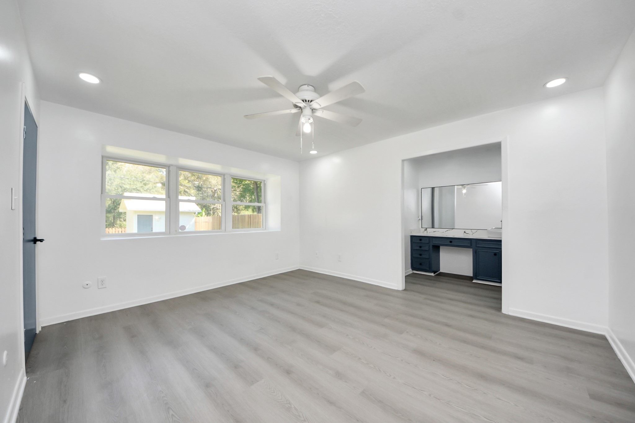 23002 Grand Rapids Lane Spring, TX 77373 - Photo 26 of 41 wooden floor in an empty room with a window