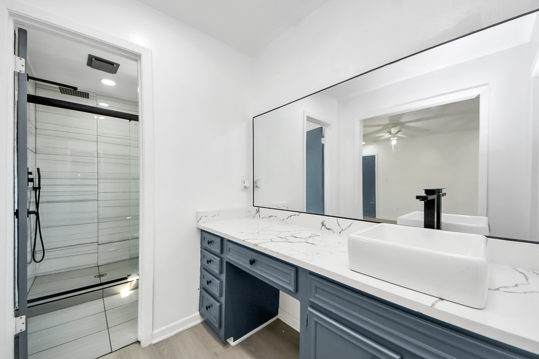 23002 Grand Rapids Lane Spring, TX 77373 - Photo 28 of 41 a bathroom with a sink and a mirror