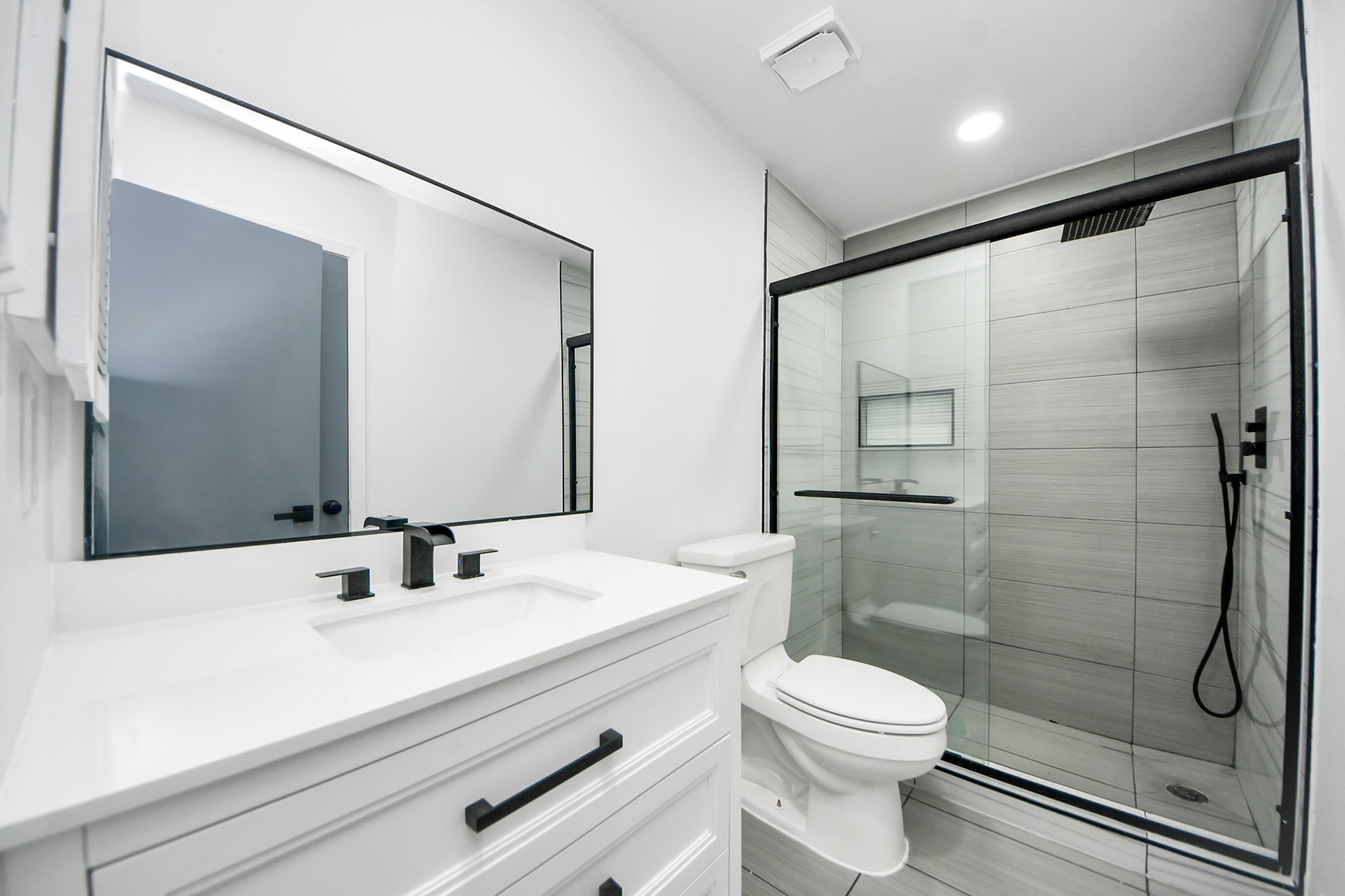 23002 Grand Rapids Lane Spring, TX 77373 - Photo 35 of 41 a bathroom with a sink a toilet and shower