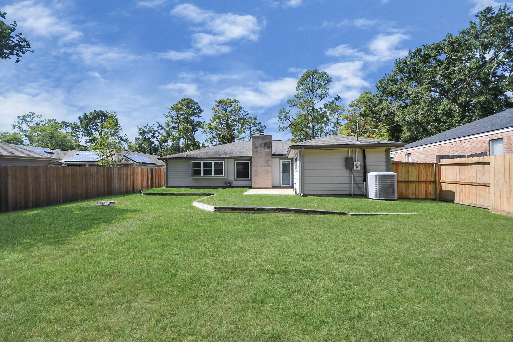 23002 Grand Rapids Lane Spring, TX 77373 - Photo 38 of 41 a backyard of a house with lots of green space