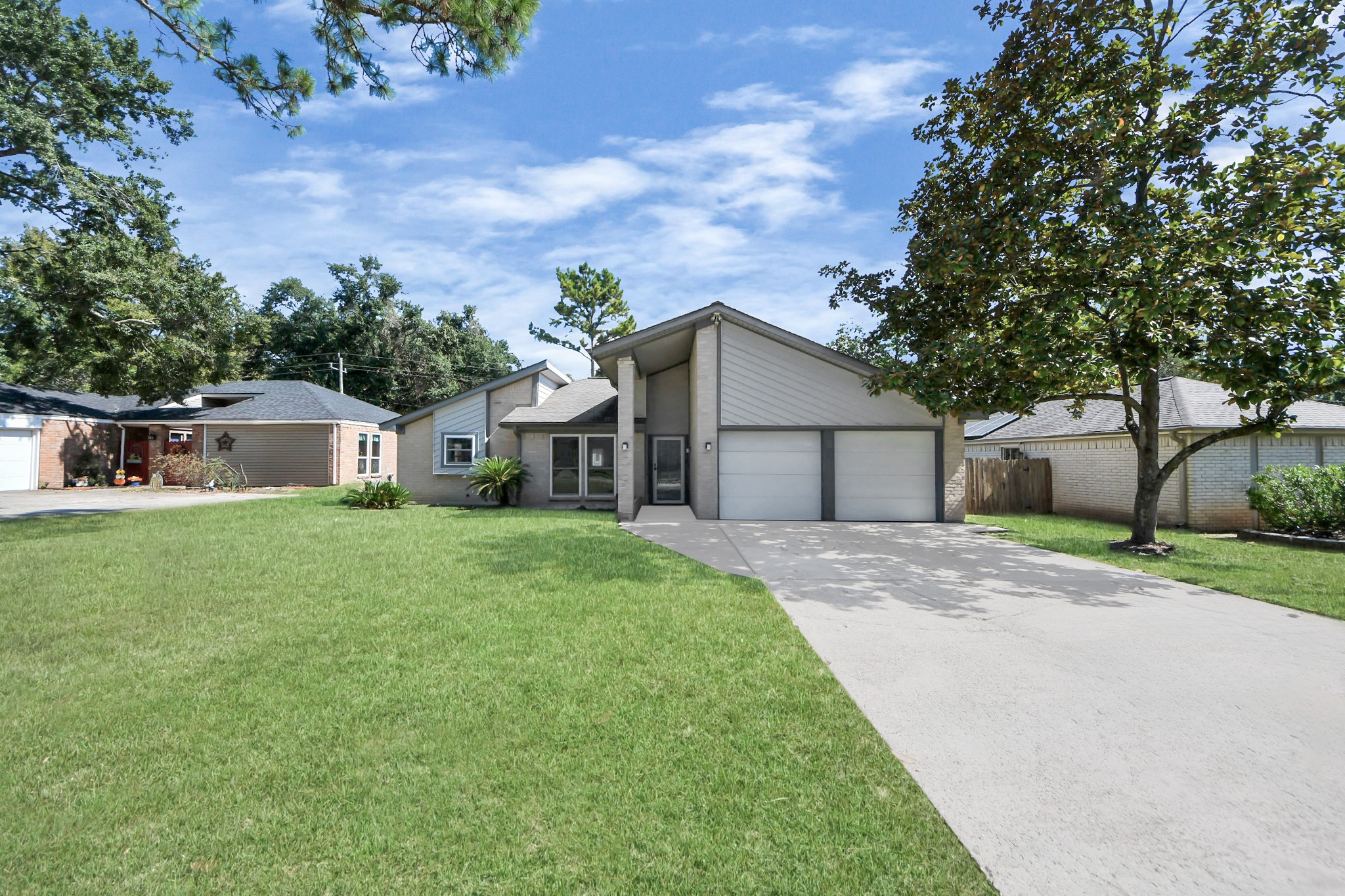 23002 Grand Rapids Lane Spring, TX 77373 - Photo 4 of 41 a front view of house with yard and green space