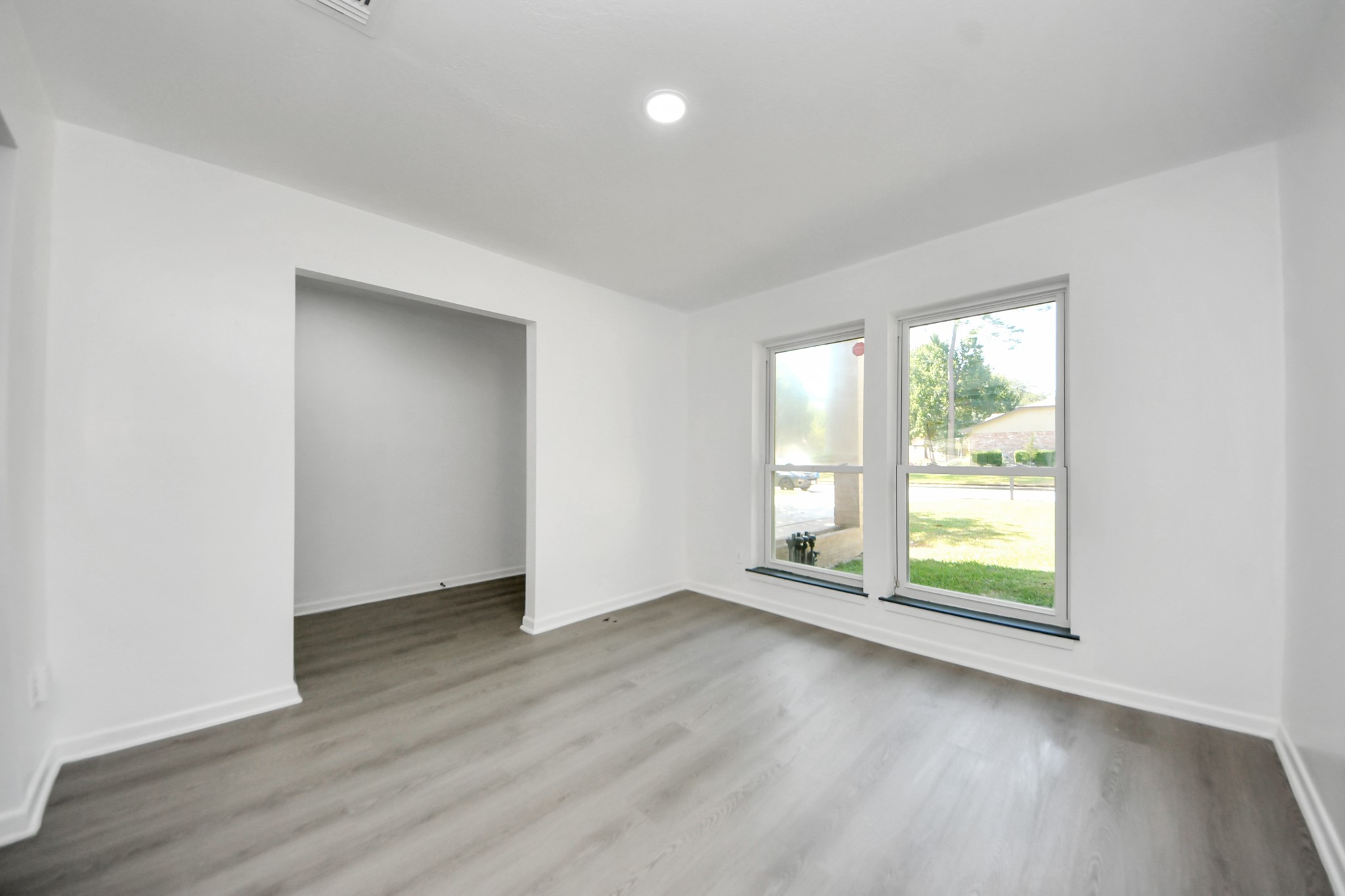 23002 Grand Rapids Lane Spring, TX 77373 - Photo 10 of 41 an empty room with wooden floor and windows